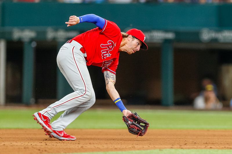 Apr 2, 2023; Arlington, Texas, USA; Philadelphia Phillies second baseman Bryson Stott (5) fields a ground ball during the seventh inning against the Texas Rangers at Globe Life Field. Mandatory Credit: Andrew Dieb-USA TODAY Sports