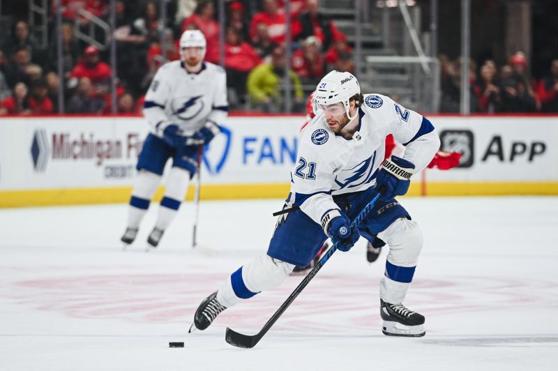 Feb 25, 2023; Detroit, Michigan, USA; Tampa Bay Lightning center Brayden Point (21) brings the puck up ice against the Detroit Red Wings during the third period at Little Caesars Arena. Mandatory Credit: Tim Fuller-USA TODAY Sports