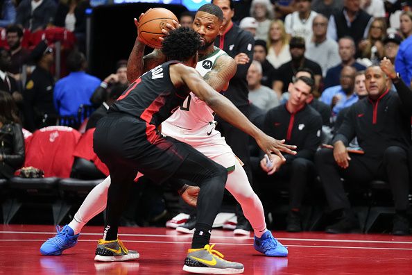 MIAMI, FLORIDA - NOVEMBER 28: Damian Lillard #0 of the Milwaukee Bucks dribbles the ball against Josh Richardson #0 of the Miami Heat in the first quarter during the NBA In-season Tournament game at Kaseya Center on November 28, 2023 in Miami, Florida. NOTE TO USER: User Expressly acknowledges and agrees that, by downloading and or using this photograh, User is consenting to the terms and conditions of the Getty Images License Agreement. (Photo by Rich Storry/Getty Images)