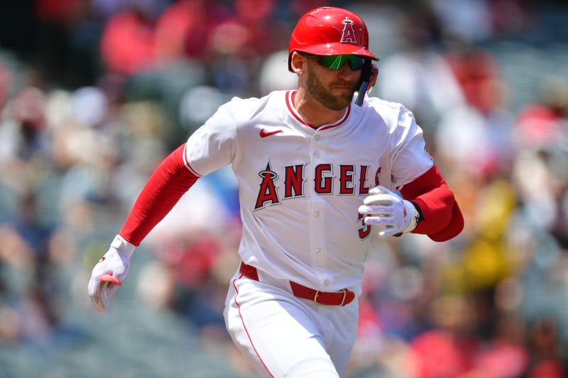 May 1, 2024; Anaheim, California, USA; Los Angeles Angels outfielder Taylor Ward (3) reaches first on a wild pitch by Philadelphia Phillies pitcher Zack Wheeler (45) during the first inning at Angel Stadium. Mandatory Credit: Gary A. Vasquez-USA TODAY Sports