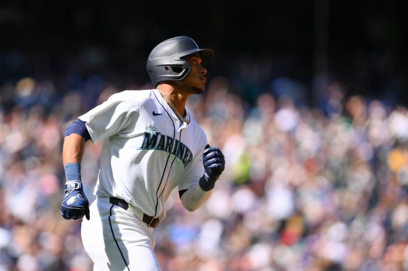 Apr 14, 2024; Seattle, Washington, USA; Seattle Mariners second baseman Jorge Polanco (7) runs towards first base after hitting a 2-run home run against the Chicago Cubs during the sixth inning at T-Mobile Park. Mandatory Credit: Steven Bisig-USA TODAY Sports