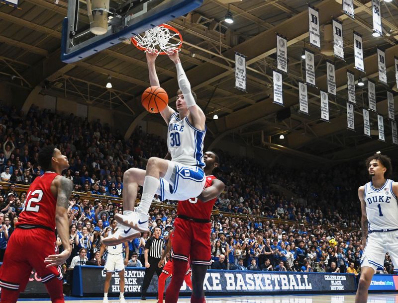 Feb 20, 2023; Durham, North Carolina, USA; Duke Blue Devils center Kyle Filipowski (30) dunks during the second half against the Louisville Cardinals at Cameron Indoor Stadium. The Blue Devils won 79-62. Mandatory Credit: Rob Kinnan-USA TODAY Sports