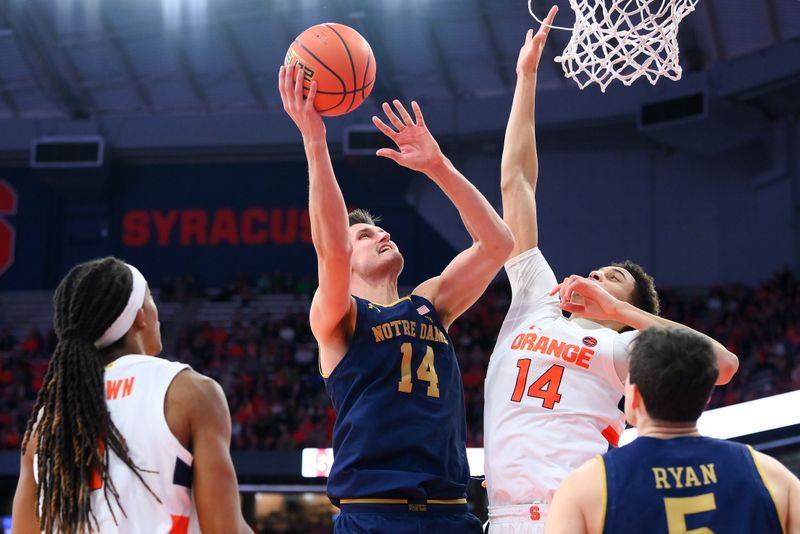 Jan 14, 2023; Syracuse, New York, USA; Notre Dame Fighting Irish forward Nate Laszewski (14) shoots the ball against the defense of Syracuse Orange center Jesse Edwards (14) during the second half at the JMA Wireless Dome. Mandatory Credit: Rich Barnes-USA TODAY Sports