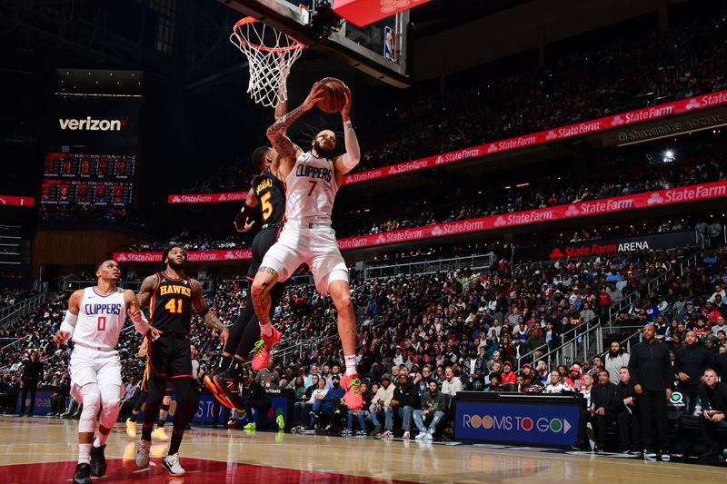 ATLANTA, GA - FEBRUARY 5: Amir Coffey #7 of the LA Clippers grabs a rebound during the game against the Atlanta Hawks on February 5, 2024 at State Farm Arena in Atlanta, Georgia.  NOTE TO USER: User expressly acknowledges and agrees that, by downloading and/or using this Photograph, user is consenting to the terms and conditions of the Getty Images License Agreement. Mandatory Copyright Notice: Copyright 2024 NBAE (Photo by Scott Cunningham/NBAE via Getty Images)