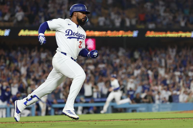 Jul 2, 2024; Los Angeles, California, USA;  Los Angeles Dodgers left fielder Teoscar Hernandez (37) hits a walk off hit to defeat the Arizona Diamondbacks  in bottom of the ninth inning at Dodger Stadium. Mandatory Credit: Kiyoshi Mio-USA TODAY Sports