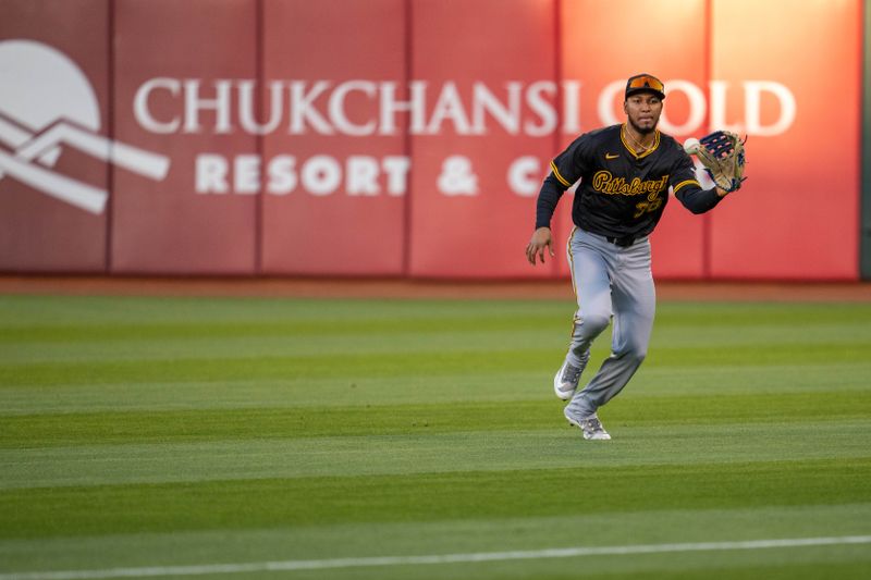 Apr 30, 2024; Oakland, California, USA;  Pittsburgh Pirates outfielder Edward Olivares (38) fields a fly ball hit by Oakland Athletics third baseman Tyler Nevin (not pictured) during the second inning at Oakland-Alameda County Coliseum. Mandatory Credit: Neville E. Guard-USA TODAY Sports