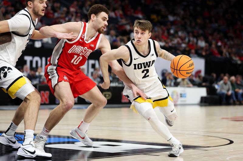 Mar 14, 2024; Minneapolis, MN, USA; Iowa Hawkeyes guard Brock Harding (2) works around Ohio State Buckeyes forward Jamison Battle (10) during the first half at Target Center. Mandatory Credit: Matt Krohn-USA TODAY Sports