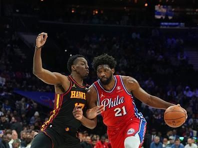 PHILADELPHIA, PENNSYLVANIA - DECEMBER 8: Joel Embiid #21 of the Philadelphia 76ers drives to the basket against Onyeka Okongwu #17 of the Atlanta Hawks in the first quarter at the Wells Fargo Center on December 8, 2023 in Philadelphia, Pennsylvania. NOTE TO USER: User expressly acknowledges and agrees that, by downloading and or using this photograph, User is consenting to the terms and conditions of the Getty Images License Agreement. (Photo by Mitchell Leff/Getty Images)