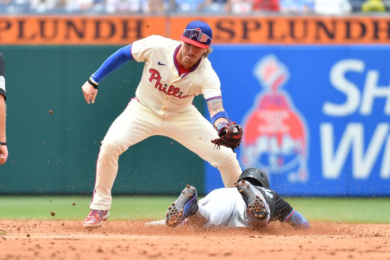 Jun 30, 2024; Philadelphia, Pennsylvania, USA; Philadelphia Phillies second base Bryson Stott (5) tags out Miami Marlins outfielder Jazz Chisholm Jr. (2) trying to steal second base during the third inning at Citizens Bank Park. Mandatory Credit: Eric Hartline-USA TODAY Sports