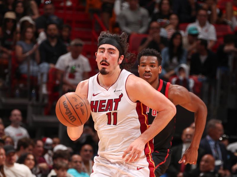 MIAMI, FL - APRIL 14:  Jaime Jaquez Jr. #11 of the Miami Heat handles the ball during the game on April 14, 2024 at Kaseya Center in Miami, Florida. NOTE TO USER: User expressly acknowledges and agrees that, by downloading and or using this Photograph, user is consenting to the terms and conditions of the Getty Images License Agreement. Mandatory Copyright Notice: Copyright 2024 NBAE (Photo by Issac Baldizon/NBAE via Getty Images)