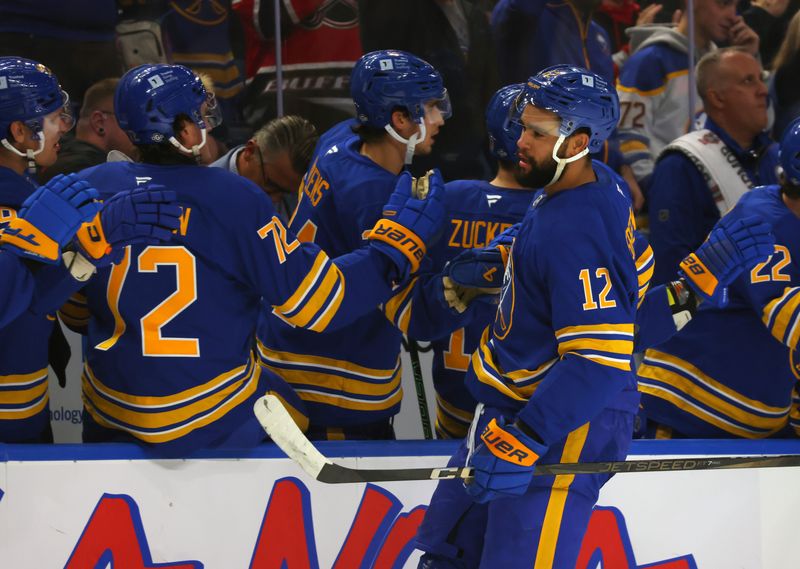 Oct 12, 2024; Buffalo, New York, USA;  Buffalo Sabres left wing Jordan Greenway (12) celebrates his goal with teammates during the first period against the Florida Panthers at KeyBank Center. Mandatory Credit: Timothy T. Ludwig-Imagn Images