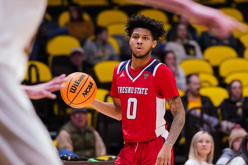 Jan 31, 2023; Laramie, Wyoming, USA; Fresno State Bulldogs guard Donavan Yap (0) looks to pass against the Wyoming Cowboys during the second half at Arena-Auditorium. Mandatory Credit: Troy Babbitt-USA TODAY Sports