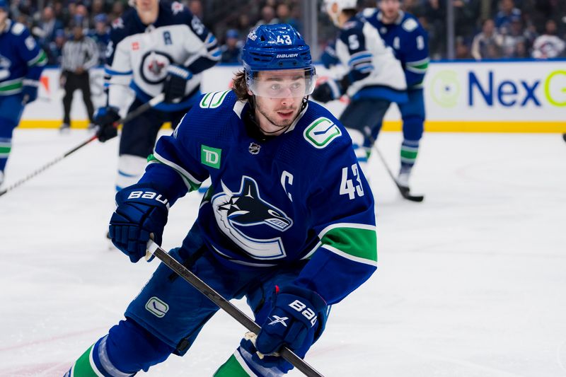 Mar 9, 2024; Vancouver, British Columbia, CAN; Vancouver Canucks defenseman Quinn Hughes (43) skates against the Winnipeg Jets in the third period at Rogers Arena. Canucks won 5-0. Mandatory Credit: Bob Frid-USA TODAY Sports