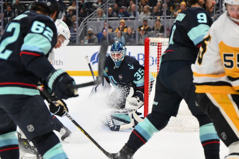 Jan 25, 2025; Seattle, Washington, USA; Seattle Kraken goaltender Joey Daccord (35) defends the goal against the Pittsburgh Penguins during the second period at Climate Pledge Arena. Mandatory Credit: Steven Bisig-Imagn Images