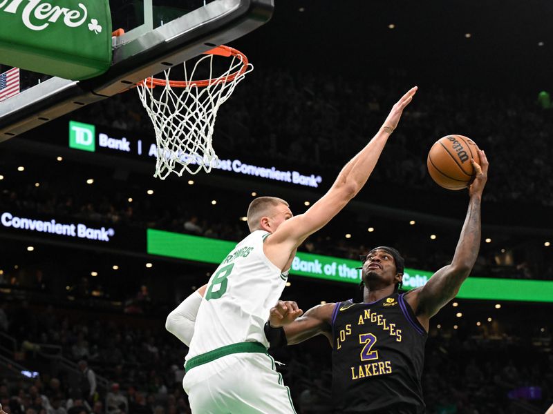 BOSTON, MASSACHUSETTS - FEBRUARY 01: Kristaps Porzingis #8 of the Boston Celtics defends Jarred Vanderbilt #2 of the Los Angeles Lakers during the first quarter at the TD Garden on February 01, 2024 in Boston, Massachusetts. NOTE TO USER: User expressly acknowledges and agrees that, by downloading and or using this photograph, User is consenting to the terms and conditions of the Getty Images License Agreement. (Photo by Brian Fluharty/Getty Images)