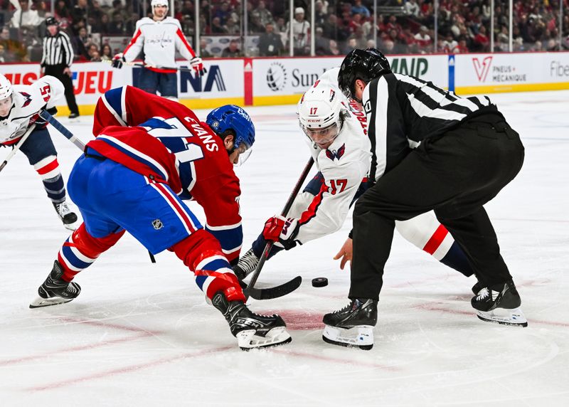 Oct 21, 2023; Montreal, Quebec, CAN; NHL linesman Jonathan Deschamps (80) drops the puck at a face-off between Montreal Canadiens center Jake Evans (71) and Washington Capitals center Dylan Strome (17) during the third period at Bell Centre. Mandatory Credit: David Kirouac-USA TODAY Sports