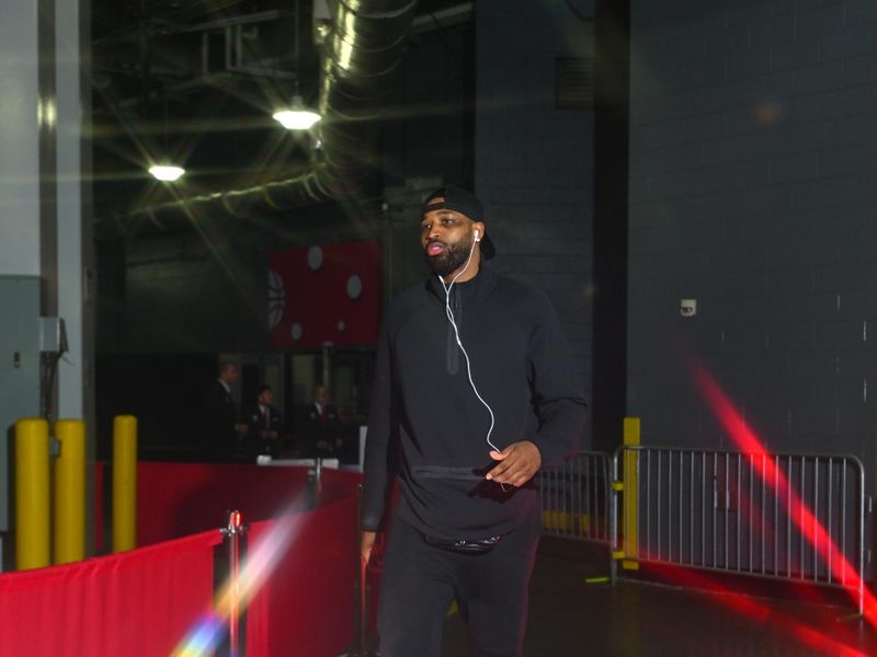 HOUSTON, TX - MARCH 16:  (EDITORS NOTE: This image was captured using a star filter) Tristian Thompson #13 of the Cleveland Cavaliers arrives to the arena before the game against the Houston Rockets on March 16, 2023 at the Toyota Center in Houston, Texas. NOTE TO USER: User expressly acknowledges and agrees that, by downloading and or using this photograph, User is consenting to the terms and conditions of the Getty Images License Agreement. Mandatory Copyright Notice: Copyright 2024 NBAE (Photo by Logan Riely/NBAE via Getty Images)