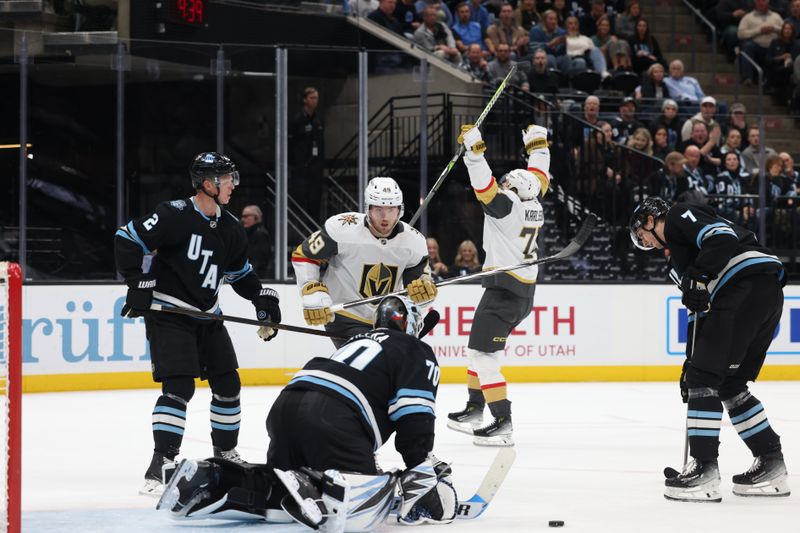 Nov 15, 2024; Salt Lake City, Utah, USA; Vegas Golden Knights center William Karlsson (rear) celebrates a goal against the Utah Hockey Club during the third period at Delta Center. Mandatory Credit: Rob Gray-Imagn Images