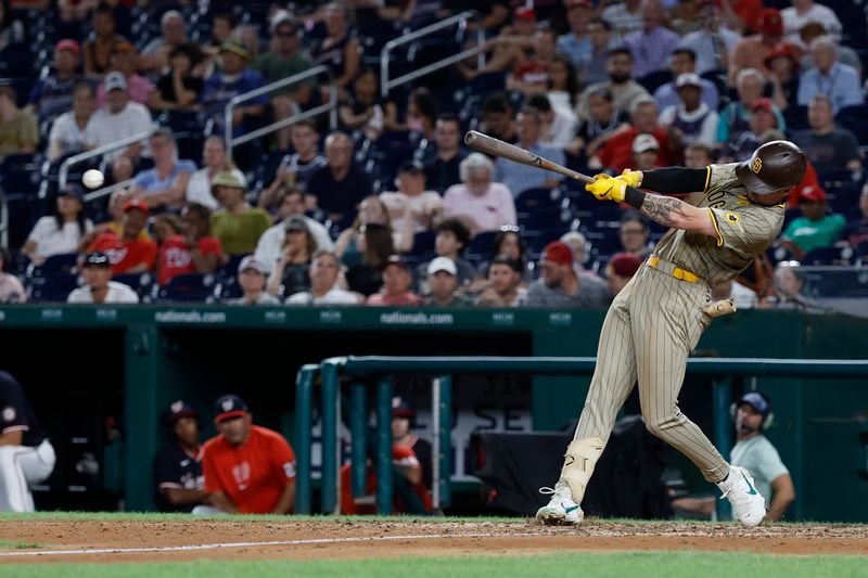 Jul 24, 2024; Washington, District of Columbia, USA; San Diego Padres outfielder Jackson Merrill (3) singles against the Washington Nationals during the eighth inning at Nationals Park. Mandatory Credit: Geoff Burke-USA TODAY Sports