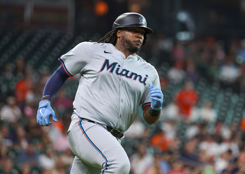 Jul 10, 2024; Houston, Texas, USA; Miami Marlins designated hitter Josh Bell (9) runs to first base on a single during the second inning against the Houston Astros at Minute Maid Park. Mandatory Credit: Troy Taormina-USA TODAY Sports