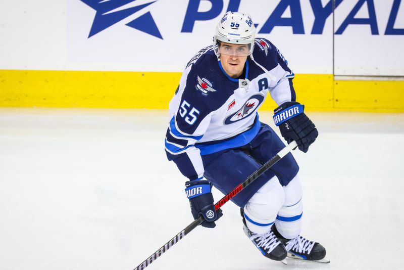 Feb 19, 2024; Calgary, Alberta, CAN; Winnipeg Jets center Mark Scheifele (55) skates during the warmup period against the Calgary Flames at Scotiabank Saddledome. Mandatory Credit: Sergei Belski-USA TODAY Sports