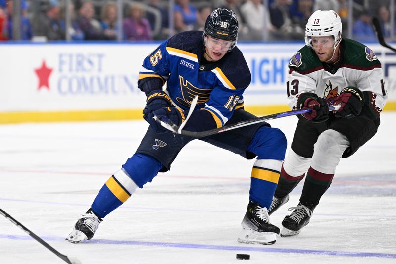 Sep 23, 2023; St. Louis, Missouri, USA; Arizona Coyotes forward Nathan Smith (13) pressures St. Louis Blues left wing Jakub Vrana (15) during the second period at Enterprise Center. Mandatory Credit: Jeff Le-USA TODAY Sports