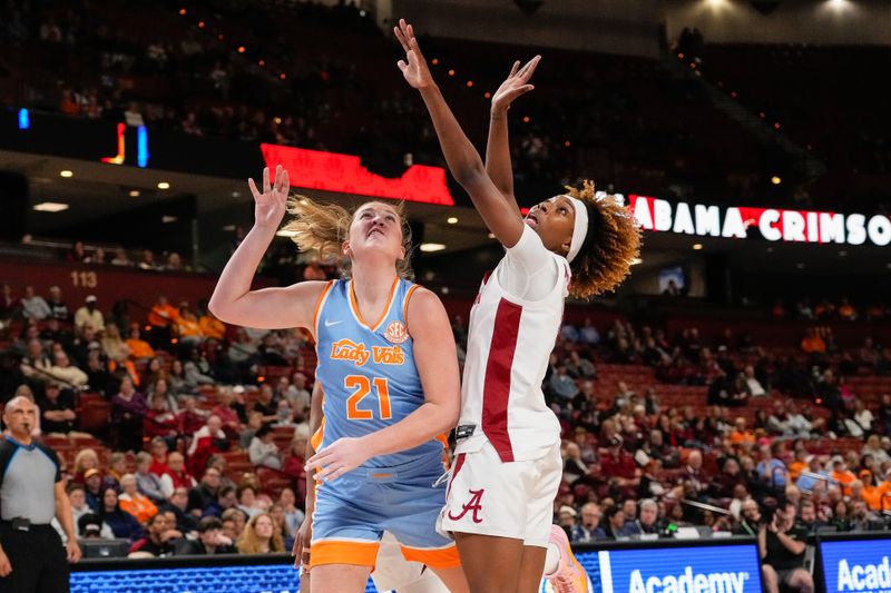 Mar 8, 2024; Greensville, SC, USA; Tennessee Lady Vols guard Tess Darby (21) shoots against Alabama Crimson Tide guard Loyal McQueen (0) during the second half at Bon Secours Wellness Arena. Mandatory Credit: Jim Dedmon-USA TODAY Sports