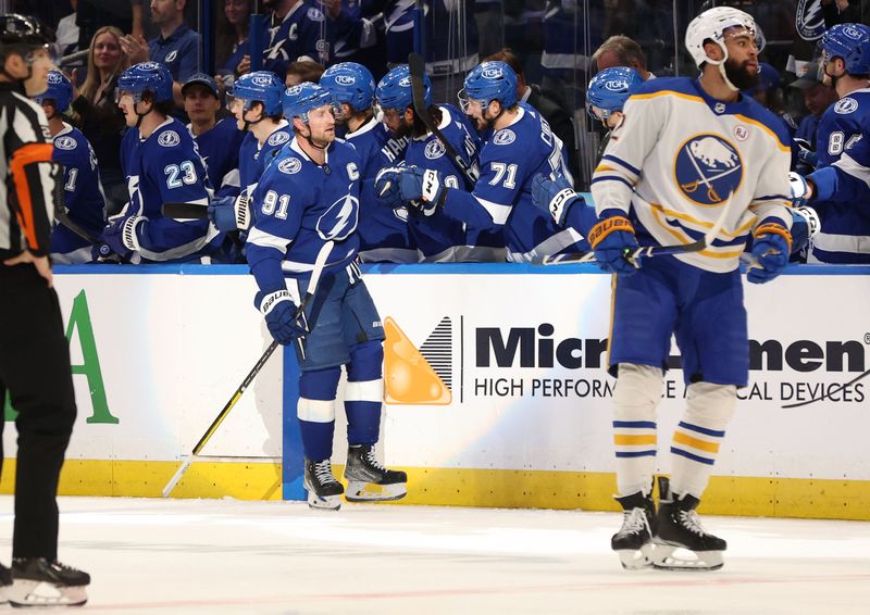 Apr 15, 2024; Tampa, Florida, USA;  Tampa Bay Lightning center Steven Stamkos (91) is congratulated after he scored a goal during the second period against the Buffalo Sabres at Amalie Arena. Mandatory Credit: Kim Klement Neitzel-USA TODAY Sports