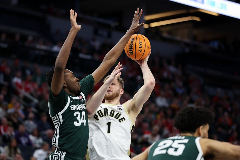 Mar 15, 2024; Minneapolis, MN, USA; Purdue Boilermakers forward Caleb Furst (1) shoots as Michigan State Spartans forward Xavier Booker (34) defends during the first half at Target Center. Mandatory Credit: Matt Krohn-USA TODAY Sports