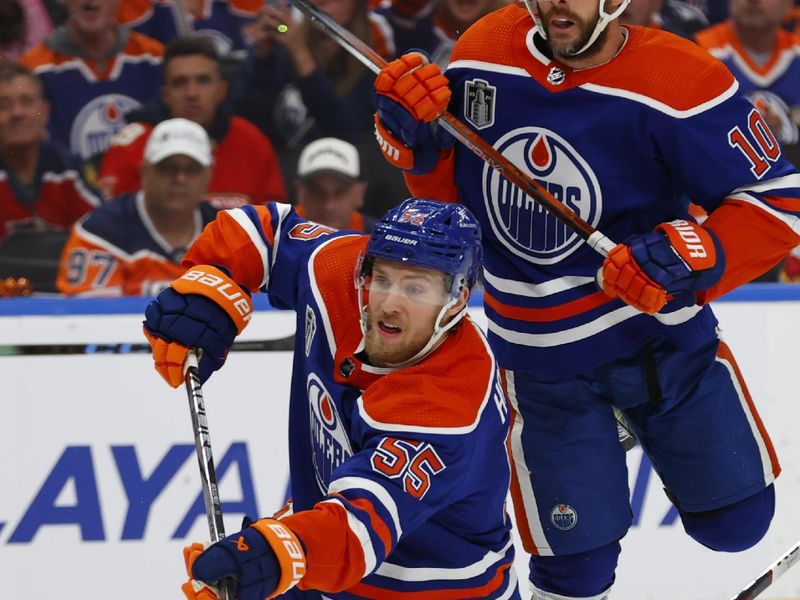 Jun 13, 2024; Edmonton, Alberta, CAN; Edmonton Oilers left wing Dylan Holloway (55) plays the puck in the second period against the Florida Panthers in game three of the 2024 Stanley Cup Final at Rogers Place. Mandatory Credit: Perry Nelson-USA TODAY Sports