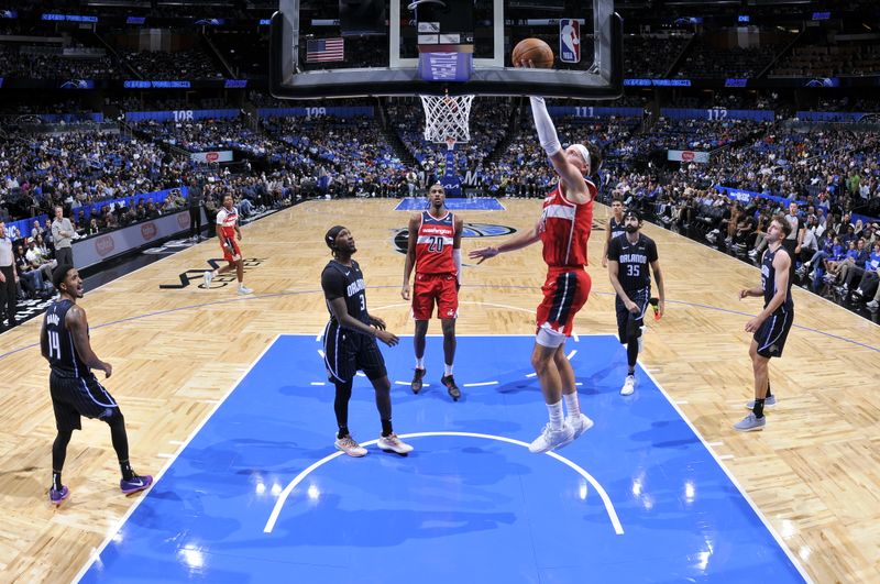 ORLANDO, FL - NOVMEBER 10: Corey Kispert #24 of the Washington Wizards drives to the basket during the game against the Orlando Magic on November 10, 2024 at Kia Center in Orlando, Florida. NOTE TO USER: User expressly acknowledges and agrees that, by downloading and or using this photograph, User is consenting to the terms and conditions of the Getty Images License Agreement. Mandatory Copyright Notice: Copyright 2024 NBAE (Photo by Fernando Medina/NBAE via Getty Images)