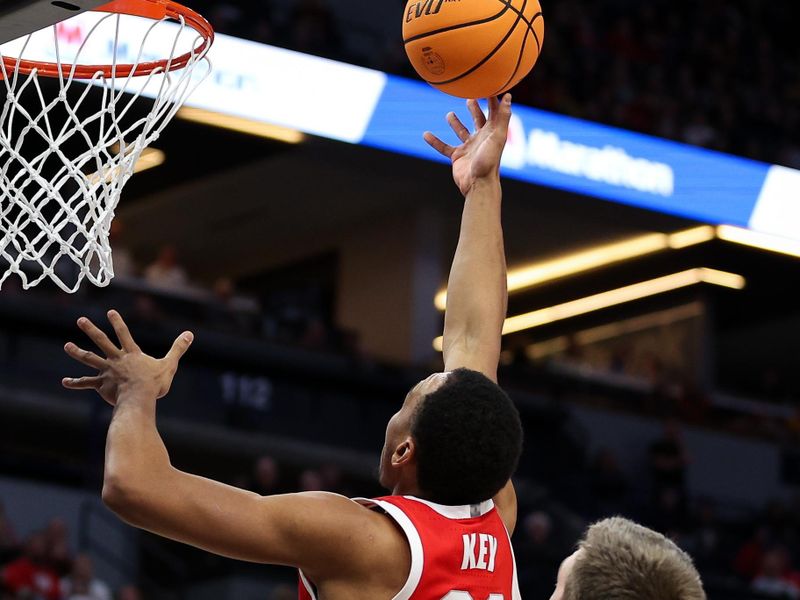 Mar 14, 2024; Minneapolis, MN, USA; Ohio State Buckeyes forward Zed Key (23) shoots as Iowa Hawkeyes forward Payton Sandfort (20) defends during the second half at Target Center. Mandatory Credit: Matt Krohn-USA TODAY Sports