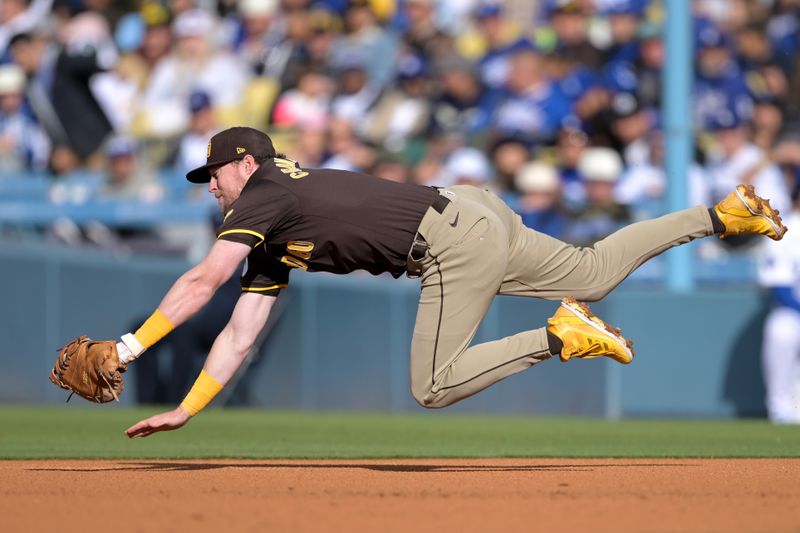 Apr 14, 2024; Los Angeles, California, USA;  Los Angeles Dodgers outfielder James Outman (33) lines out to San Diego Padres first base Jake Cronenworth (9) in the second inning at Dodger Stadium. Mandatory Credit: Jayne Kamin-Oncea-USA TODAY Sports