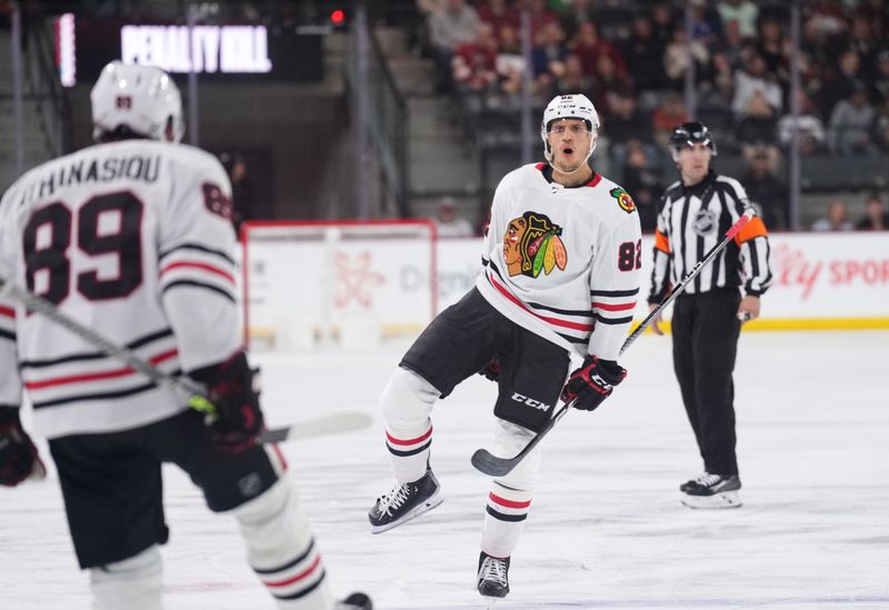 Mar 18, 2023; Tempe, Arizona, USA; Chicago Blackhawks defenseman Caleb Jones (82) celebrates a goal against the Arizona Coyotes during the third period at Mullett Arena. Mandatory Credit: Joe Camporeale-USA TODAY Sports