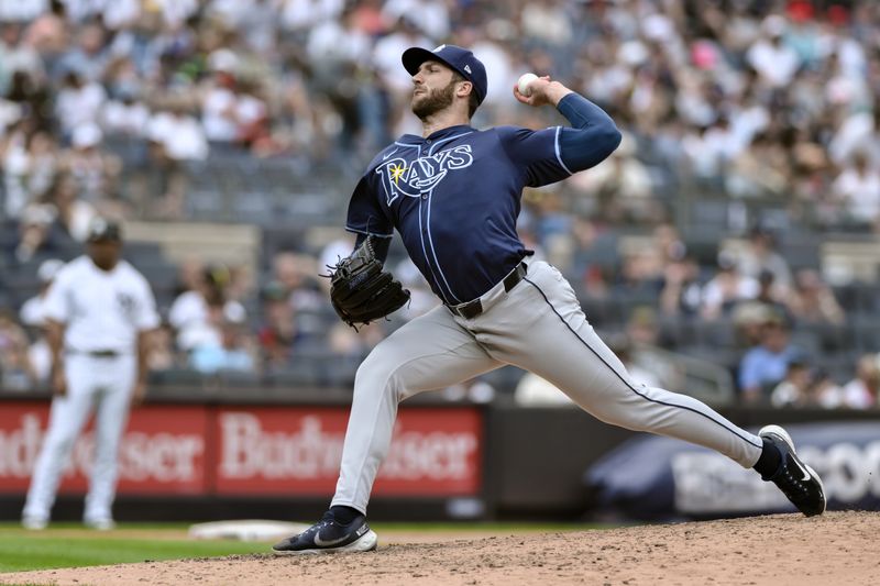 Jul 21, 2024; Bronx, New York, USA; Tampa Bay Rays pitcher Colin Poche (38) pitches against the New York Yankees during the sixth inning at Yankee Stadium. Mandatory Credit: John Jones-USA TODAY Sports