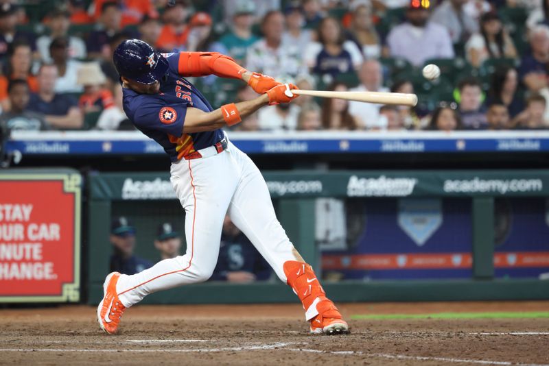 May 25, 2025; Houston, Texas, USA; Houston Astros right fielder Cam Smith (11) hits an RBI single during the sixth inning against the Seattle Mariners at Daikin Park. Mandatory Credit: Troy Taormina-Imagn Images