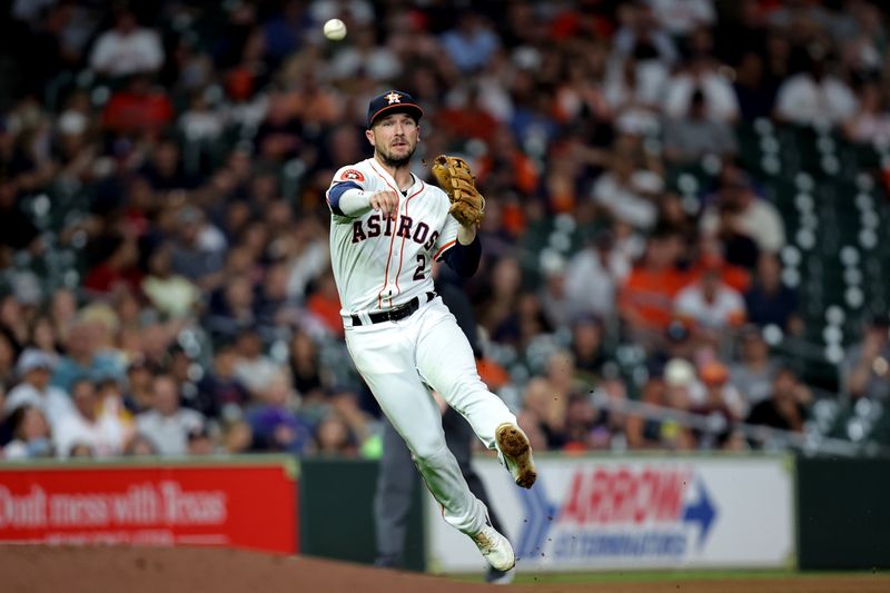 Jul 31, 2024; Houston, Texas, USA; Houston Astros third baseman Alex Bregman (2) throws to first base for an out against the Pittsburgh Pirates during the sixth inning at Minute Maid Park. Mandatory Credit: Erik Williams-USA TODAY Sports