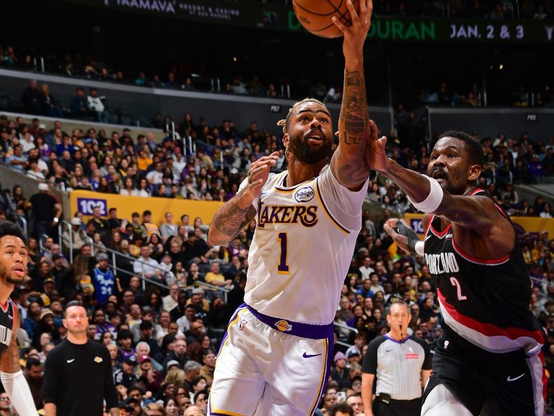 LOS ANGELES, CA - DECEMBER 8: D'Angelo Russell #1 of the Los Angeles Lakers drives to the basket during the game against the Portland Trail Blazers on December 8, 2024 at Crypto.Com Arena in Los Angeles, California. NOTE TO USER: User expressly acknowledges and agrees that, by downloading and/or using this Photograph, user is consenting to the terms and conditions of the Getty Images License Agreement. Mandatory Copyright Notice: Copyright 2024 NBAE (Photo by Adam Pantozzi/NBAE via Getty Images)