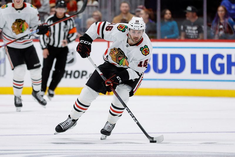 Oct 28, 2024; Denver, Colorado, USA; Chicago Blackhawks center Jason Dickinson (16) controls the puck in the third period against the Colorado Avalanche at Ball Arena. Mandatory Credit: Isaiah J. Downing-Imagn Images