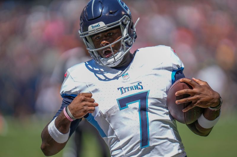 Tennessee Titans quarterback Malik Willis scores a touchdown against the Chicago Bears during the first half of an NFL preseason football game, Saturday, Aug. 12, 2023, in Chicago. (AP Photo/Erin Hooley)