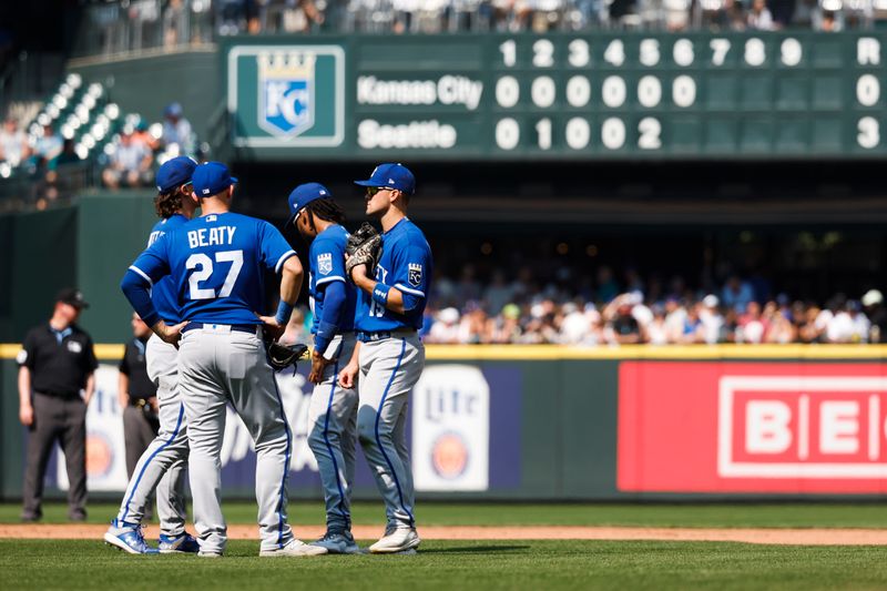 Aug 27, 2023; Seattle, Washington, USA; Kansas City Royals shortstop Bobby Witt Jr. (7), first baseman Matt Beaty (27), third baseman Maikel Garcia (11) and second baseman Michael Massey (19) talk during a sixth inning pitching change against the Seattle Mariners at T-Mobile Park. Mandatory Credit: Joe Nicholson-USA TODAY Sports