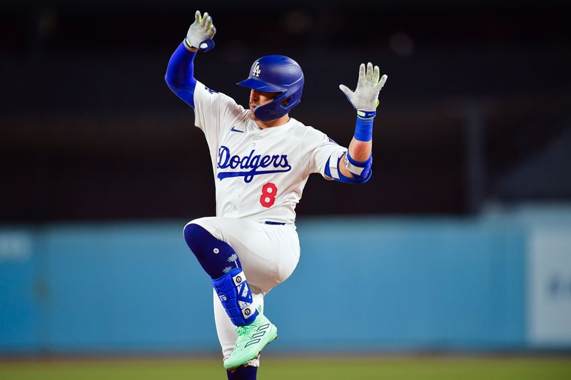 Apr 3, 2024; Los Angeles, California, USA; Los Angeles Dodgers center fielder Enrique Hernandez (8) reaches first on a single against the San Francisco Giants during the second inning at Dodger Stadium. Mandatory Credit: Gary A. Vasquez-USA TODAY Sports