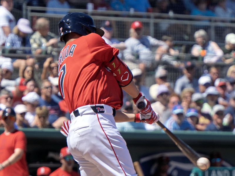 Mar 11, 2025; Fort Myers, Florida, USA; Boston Red Sox Masataka Yoshida (7) flies out to left field during their spring training game with the Phillies at JetBlue Park at Fenway South. Mandatory Credit: Chris Tilley-Imagn Images