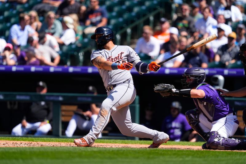 May 8, 2025; Denver, Colorado, USA; Detroit Tigers second base Gleyber Torres (25) singles in the eighth inning against the Colorado Rockies at Coors Field. Mandatory Credit: Ron Chenoy-Imagn Images