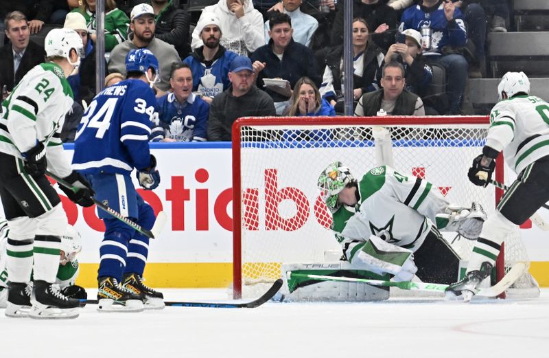 Feb 7, 2024; Toronto, Ontario, CAN; Toronto Maple Leafs forward Auston Matthews (34) scores a goal on Dallas Stars goalie Scott Wedgewood (41) in the second period at Scotiabank Arena. Mandatory Credit: Dan Hamilton-USA TODAY Sports