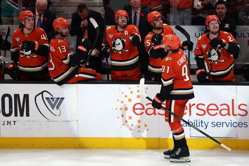 Nov 9, 2025; Anaheim, California, USA;  Anaheim Ducks center Leo Carlsson (91) celebrates with teammates after scoring a goal during the third period against the Winnipeg Jets at Honda Center. Mandatory Credit: Kiyoshi Mio-Imagn Images