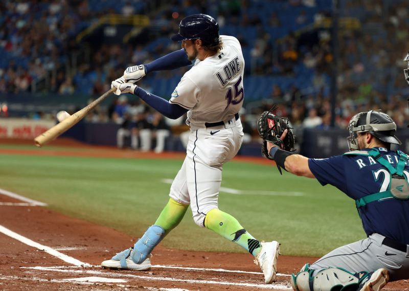 Sep 8, 2023; St. Petersburg, Florida, USA; Tampa Bay Rays right fielder Josh Lowe (15) hits a sacrifice RBI against the Seattle Mariners during the first inning at Tropicana Field. Mandatory Credit: Kim Klement Neitzel-USA TODAY Sports