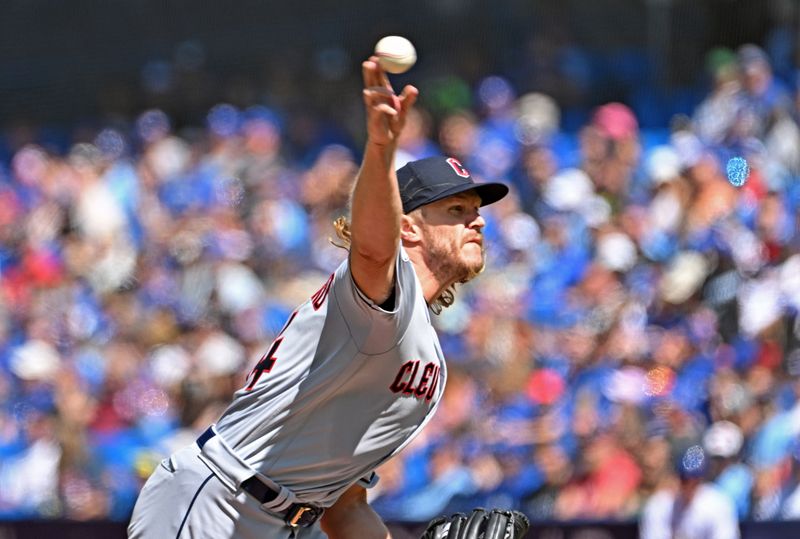 Aug 27, 2023; Toronto, Ontario, CAN;  Cleveland Guardians starting pitcher Noah Syndergaard (34) delivers a pitch against the Toronto Blue Jays in the first inning at Rogers Centre. Mandatory Credit: Dan Hamilton-USA TODAY Sports