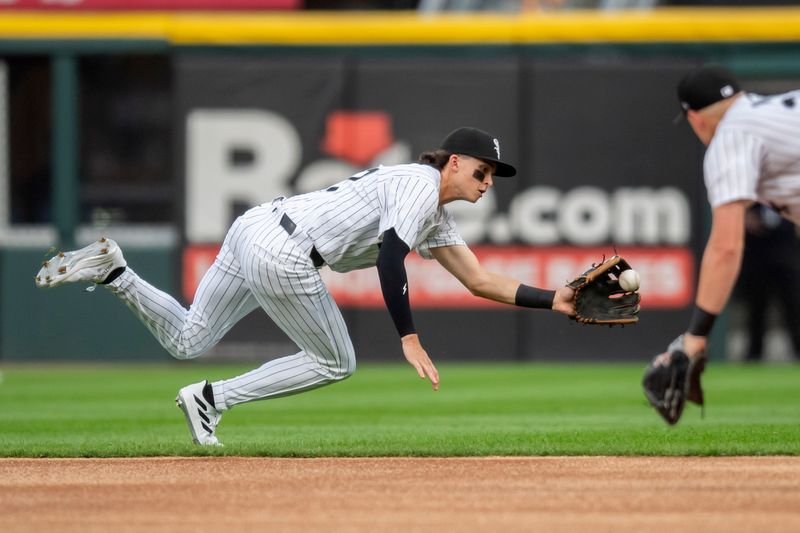 Jul 30, 2024; Chicago, Illinois, USA; Chicago White Sox shortstop Brooks Baldwin (27) fields Kansas City Royals designated hitter Michael Massey’s (not pictured) ground ball during the first inning at Guaranteed Rate Field. Mandatory Credit: Patrick Gorski-USA TODAY Sports