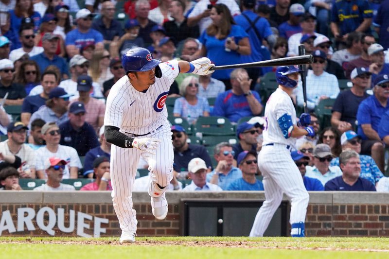 Sep 22, 2023; Chicago, Illinois, USA; Chicago Cubs right fielder Seiya Suzuki (27) hits a single against the Colorado Rockies during the sixth inning at Wrigley Field. Mandatory Credit: David Banks-USA TODAY Sports